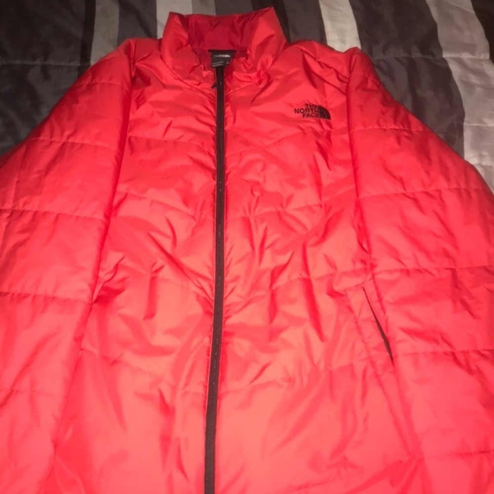 A red the north face wind breaker ish